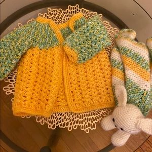 Baby’s crocheted jacked with hanky and teddy